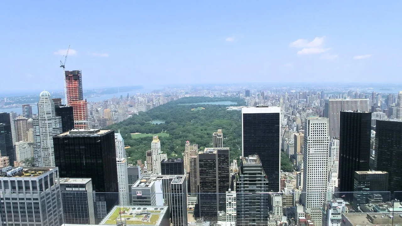 An elevated city view toward the green expanse of Central Park